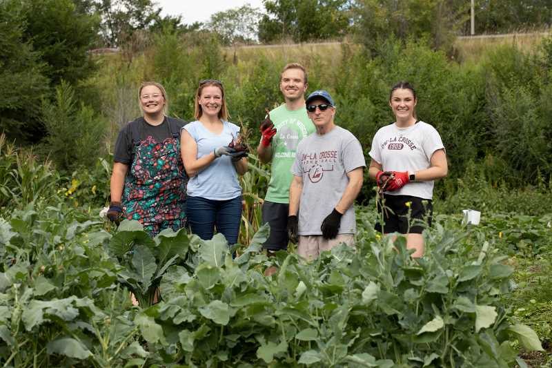 Staff from University Marketing & Communications volunteered for a late afternoon of harvesting at the Kane Street Garden last fall. Faculty, staff and students from campus are encouraged to volunteer during this spring’s community Neighbor’s Day, April 22.