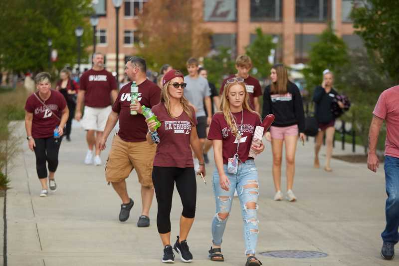 Students and families walk in front of the Veterans Memorial Field Sports Complex after the UWL Football game.