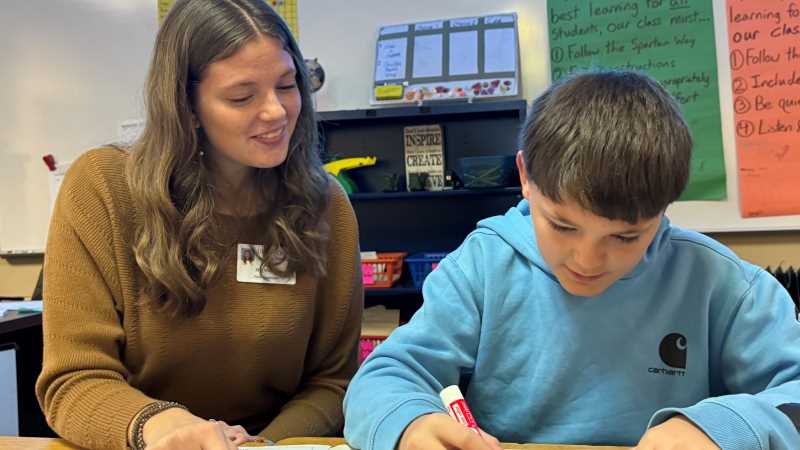 UWL senior Martha Moran helps a student at Meadowview Middle School in Sparta. Meadowview, a longtime supporter of UWL student teachers, agreed to become the university's new professional development site after the recent closure of Lincoln Middle School in La Crosse.