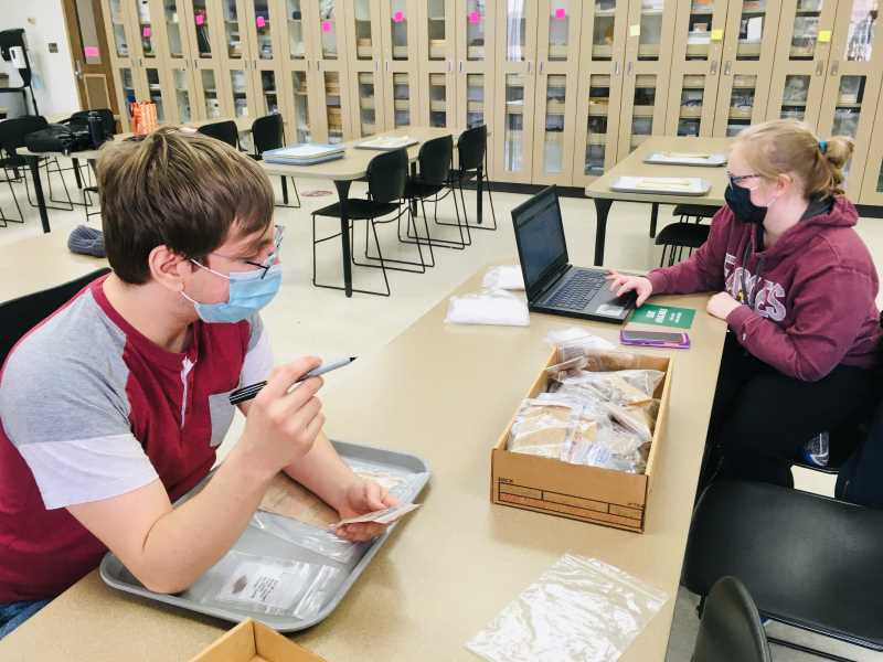 UWL students Miles Martinez, left, and Lauren Brewer document archaeological materials in the UWL Archaeology Lab during the spring 2021 semester. 