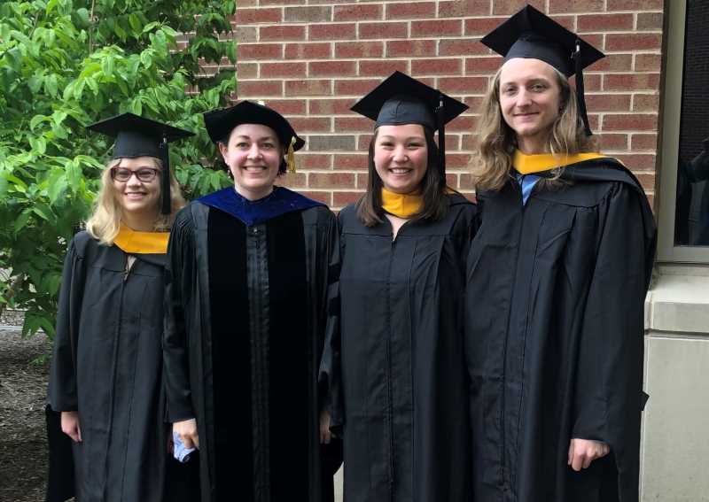 Graduate students wearing their commencement regalia.