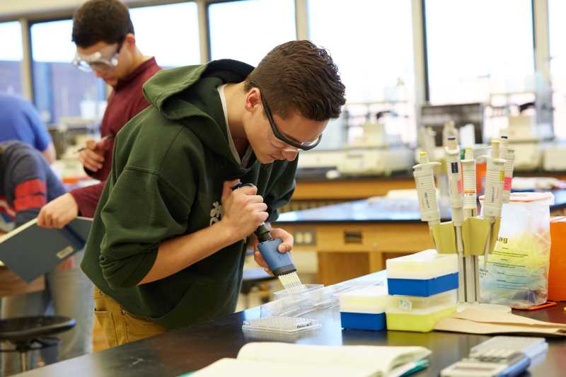 2017 image of a student in a lab doing work in biochemistry.