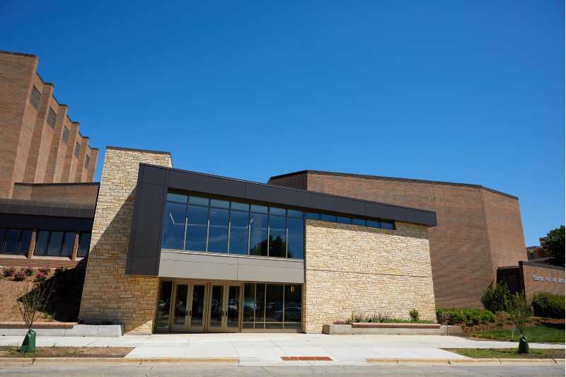 Front view of the Center of the Arts building on Vine Street with a gorgeous bright blue sky above