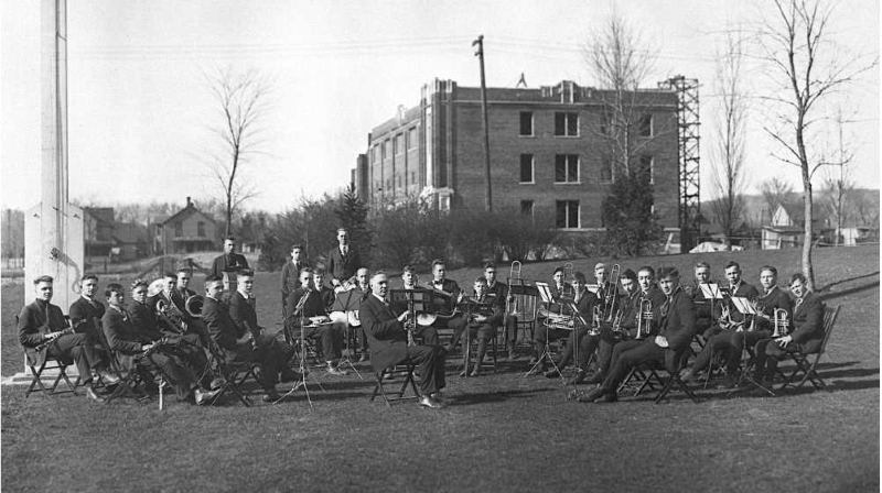 With many men headed to war in 1918, there wasn't enough interest from the La Crosse Normal School to form a band, so La Crosse Normal President Fassett Cotton recruited young men from Central High School. They are posing for a practice session in front of the unfinished physical education building, which was eventually named Wittich Hall. While construction started on the building in 1916, it was stopped during WWI, later opening in 1920. The university closed in mid-October 1918 due to the 1918 flu epidemic. Photo taken from the 1919 yearbook, courtesy of UWL Murphy Library Special Collections.