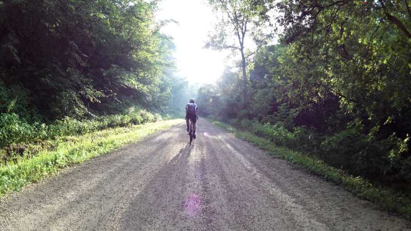 UWL History Professor James Longhurst climbs Crazy Corners road near Freeburg, Minnesota. Photo by Dan Novak.