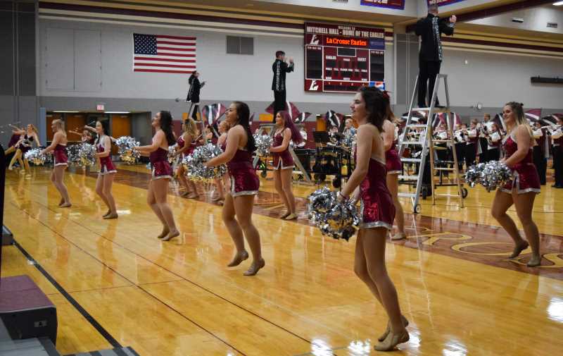 Poms performing at the marching band review concert