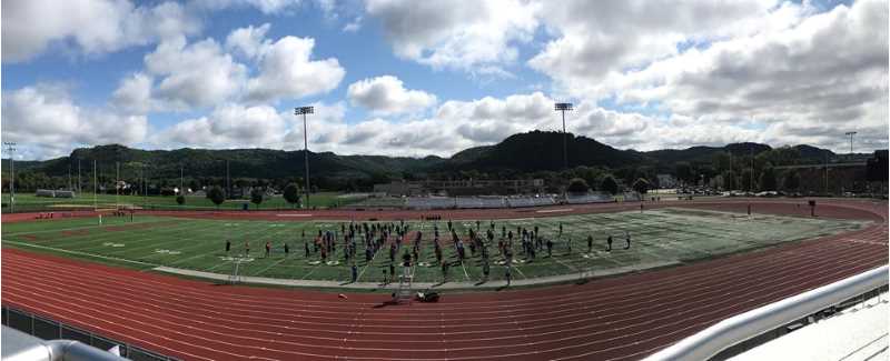 Marching band rehearsal on the football field