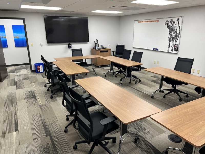 Seats 12. Space includes Sennheiser omnidirectional ceiling microphone and AVer 12x zoom 4k video camera both of which can be independently controlled from the Observation & Podcasting Room. 