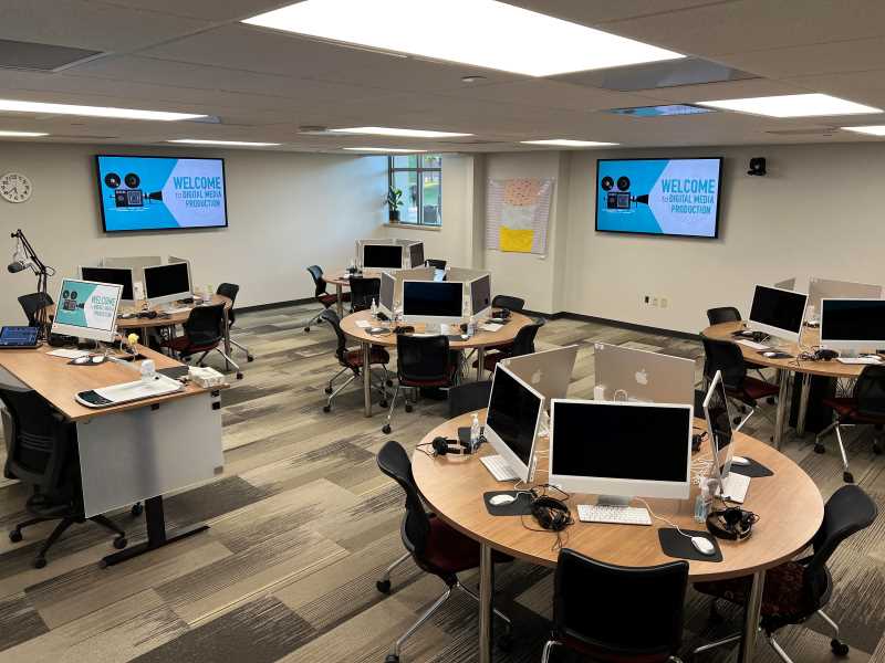Seats 25 students. Four television sets display podium projector. Space includes Sennheiser omni-directional ceiling microphone and AVer 12x zoom 4k video conferencing camera. Booking full classes in the lab requires consent of the CaML Director before the start of the semester.