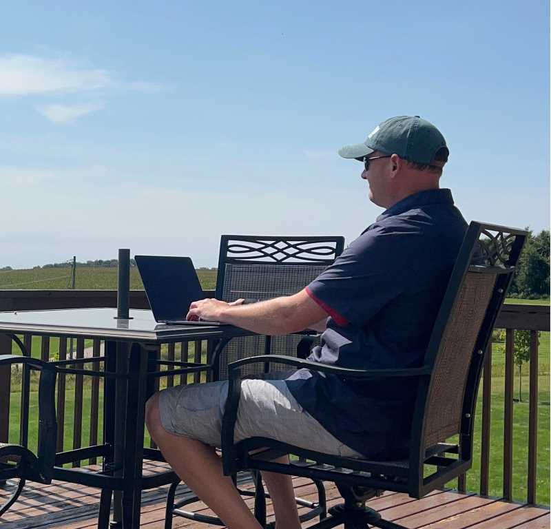 Dr. Tim Dale writing on his deck in Chaseburg, WI.