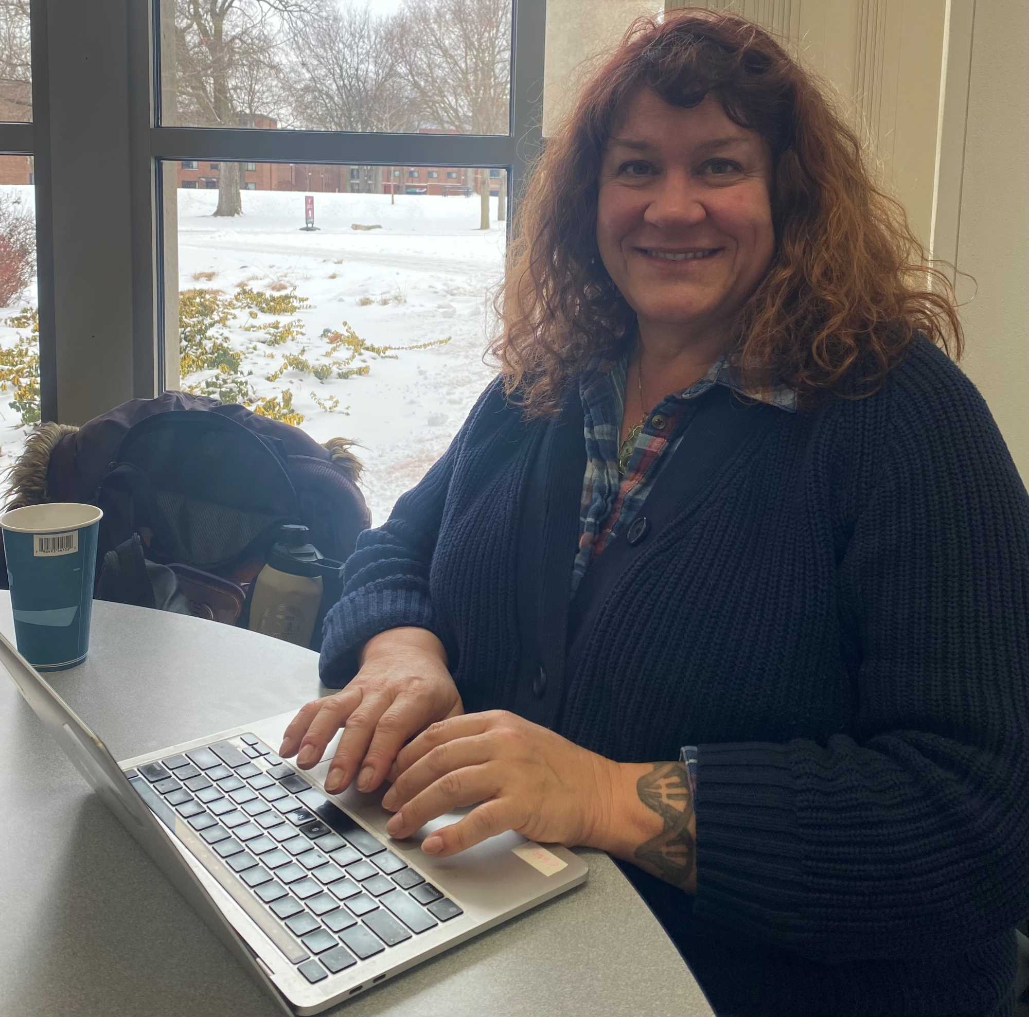Dr. Galbraith writing in Murphy Library.