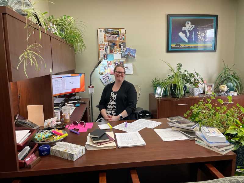 Dr. Marie Moeller at her desk in the CASSH Dean's Office.