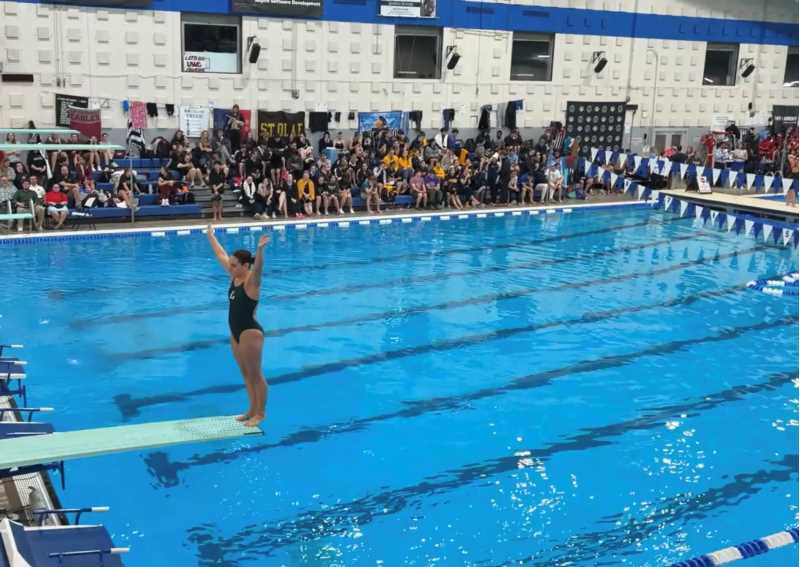 Image of the author participating in a diving competition. Photo Credit: Emma Lieb.