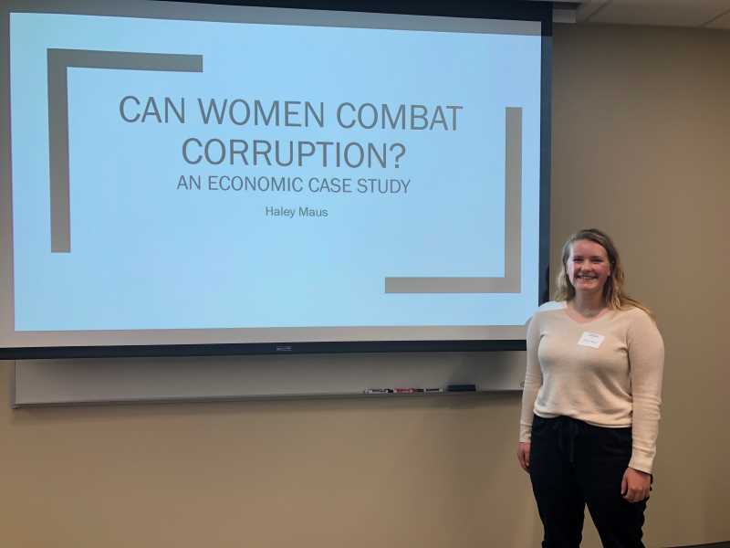 Senior Haley Maus, French/Econ double major, presenting her capstone at UWL Research & Creativity Symposium in April 2019.