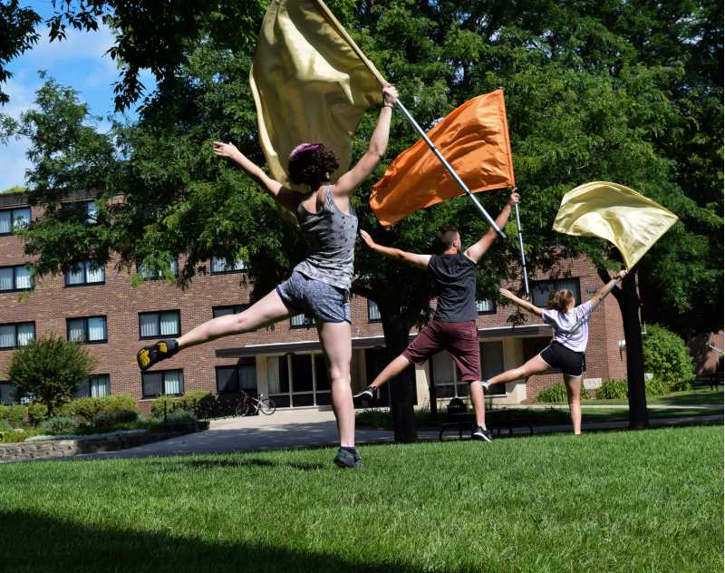 Colorguard practicing in CFA field