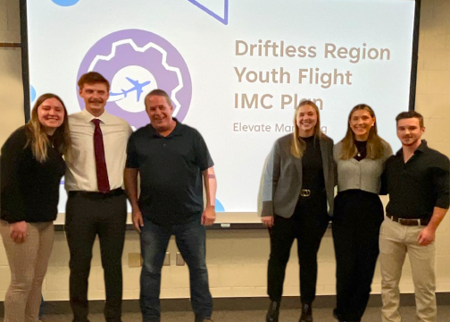 Wolfgang Rittgers poses with students following their IMC Plan presentation.   Pictured from left: Beatrice Laufer, Kerik Stubbe, Wolfgang Rittgers, Taylor Tews, Grace Crothers, Keagan Hunter 