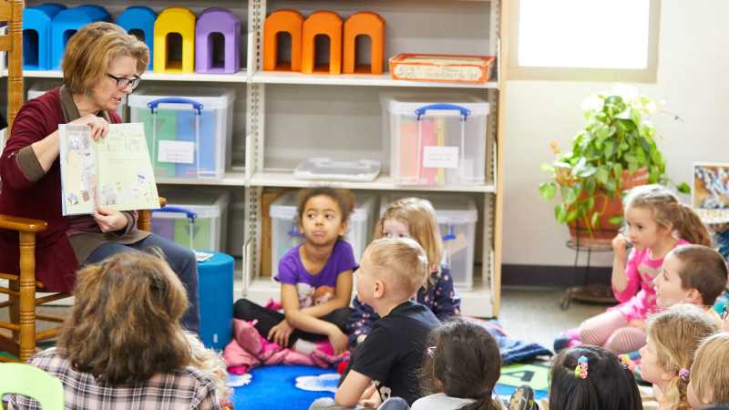 Curriculum Librarian Teri Holford during a 2019 story time with the Campus Child Center.