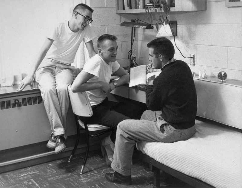 ca. 1959 / Three students are studying in their dorm room, possibly Reuter Hall.