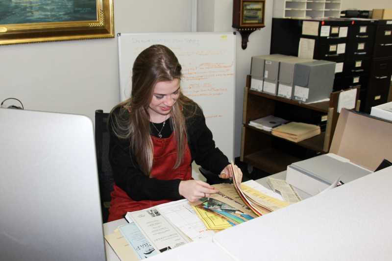Katy Davidson working in Murphy Library Special Collections/Area Research Center