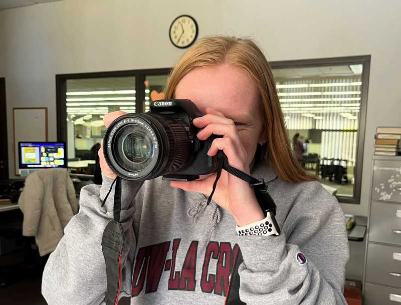 Photo of Murphy Library Outreach Student Assistant taking a photo