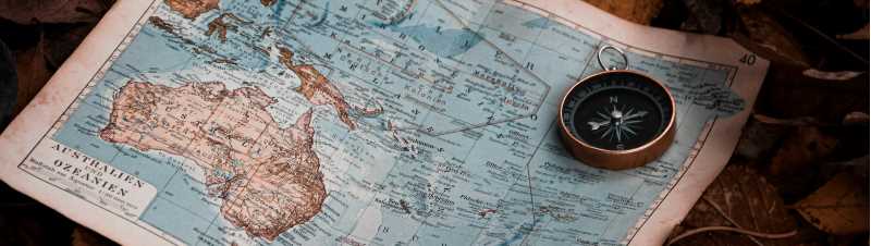 Map and compass, Photo by Denise Jans on Unsplash