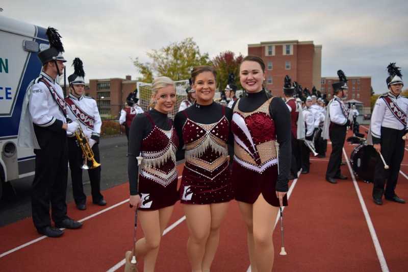 Three girls in twirler uniform