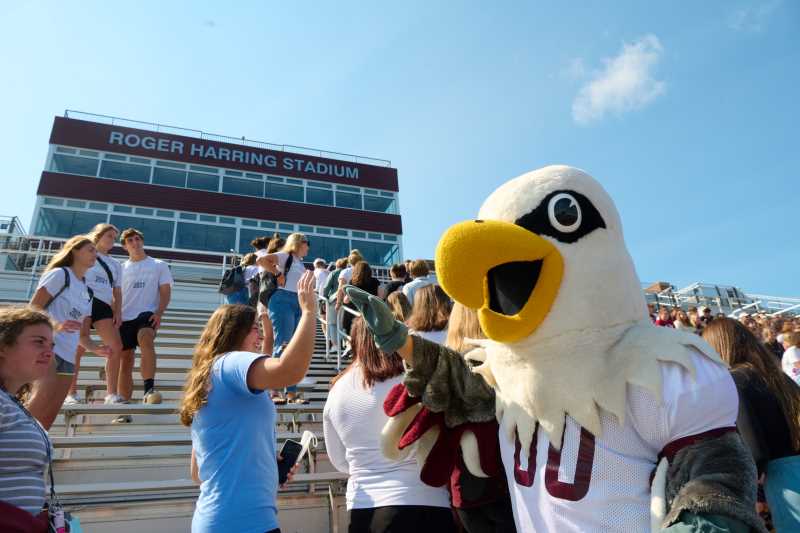 A student high fives Stryker Eagle at UWL during Welcome Week in fall 2021. New Student Orientation and Welcome Week is an amazing opportunity to meet new people and begin to form friendships.