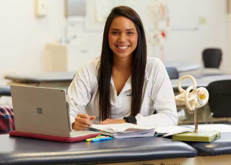 Student at desk with laptop