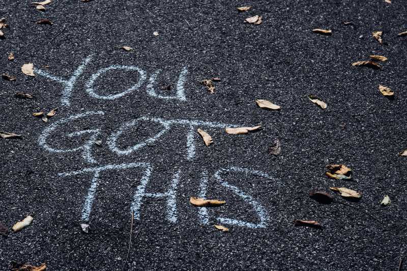 You Got This is written with chalk on pavement.