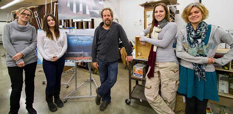 Students had an opportunity to work with internationally renowned artist John Pugh during his stop on campus while he was visiting La Crosse to prepare for a National Endowment for the Arts-funded mural. With Pugh, center, are, from left, Art Associate Professor Jennifer Terpstra, art major Molly Duggan, English major Shelby Phillips and art major Alyssa Shurbert-Hetzel. Duggan and Shurbert-Hetzel were selected as apprentices to work with Pugh in his California studio.