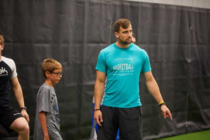 Brock McMullen, director of UWL’s Adapted Physical Education Teacher Preparation Program, works with a La Crosse area youth during an on-campus adapted sports program in 2019. UWL has received a $1.25 million U.S. Department of Education grant to help improve educational services for children with disabilities throughout the country by empowering the university’s Adapted Physical Education and School Psychology graduate programs.