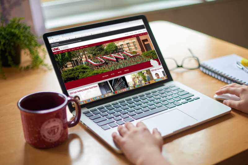 Laptop computer on a desk with coffee cup