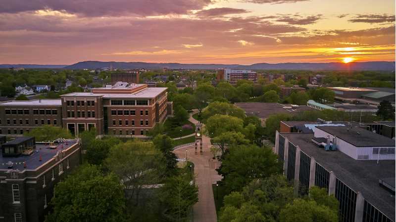 Image of campus at sunset with the Hoeshler Tower at center. The sun is setting on 2020 — a year history won't forget.