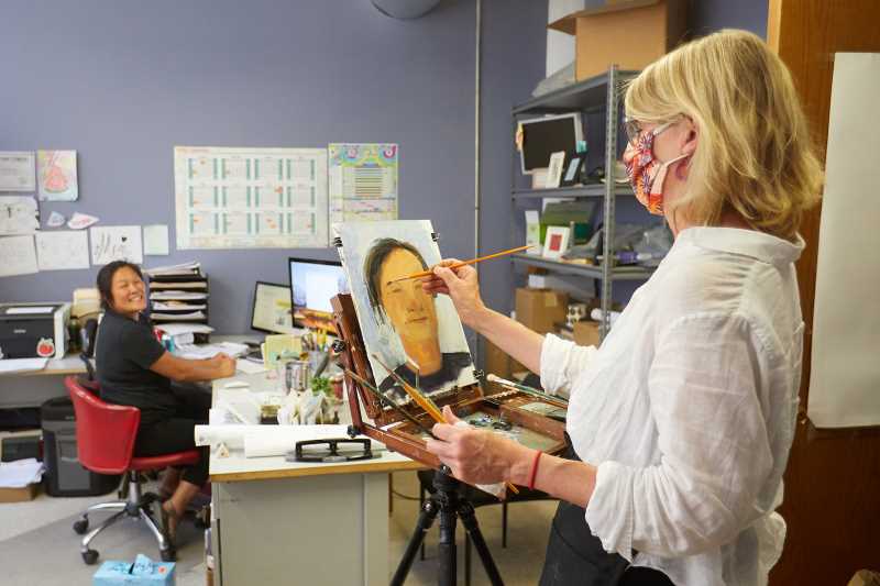 UWL Art Professor Jennifer Williams paints a portrait of Tami Plourde, co-owner and director of sales and marketing at Pearl Street Brewery. Williams visited some La Crosse business owners during the pandemic to put them on canvas to provide an insight into what people went through during the early days of the pandemic.