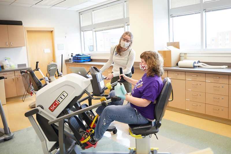 UWL graduate student Grace Gaugert guides a client through a personalized rehabilitation session as part of the Exercise Program for Adults with Neurologic Disorders. UWL Graduate Studies and UWL Extended Learning recently merged into one unit — Graduate & Extended Learning — to provide more learning opportunities for the campus and community. 