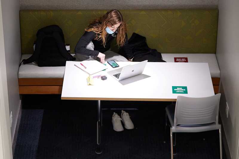Student finds a quiet spot to study at a desk on the UW-La Crosse campus