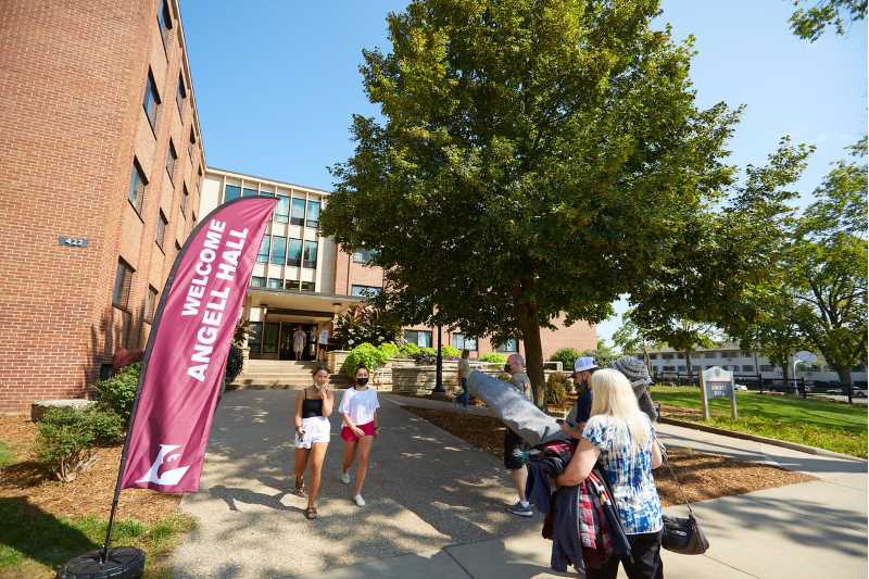 Students move belongings into Angell Hall.