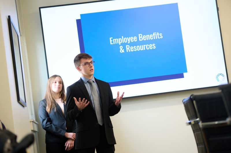 UW-La Crosse business students Claire Mistele (left) and Jackson Lescamela detail ways that Kwik Trip can design a work environment for the attraction and retention of new employees. The presentation was part of the Kwik Trip Integrated Core Program at UWL.