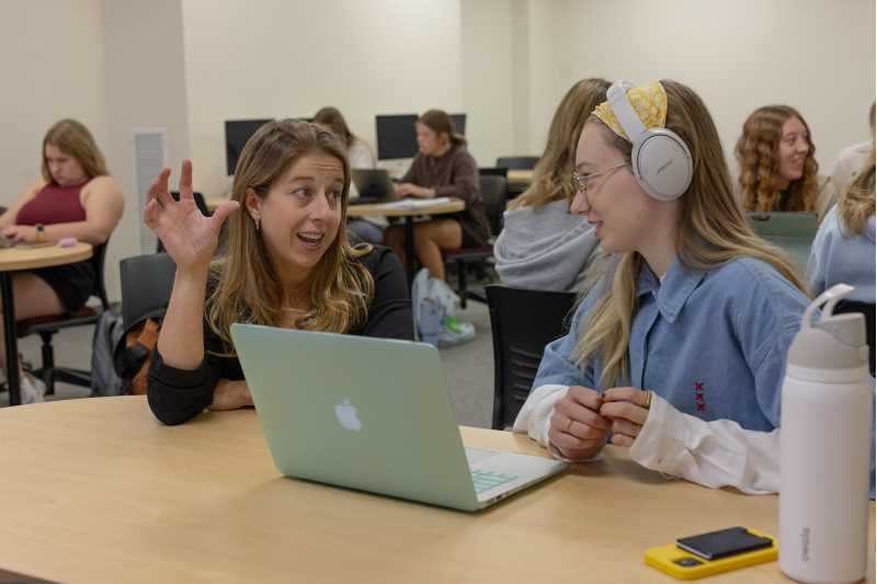 Tesia Marshik teaches a student in class.