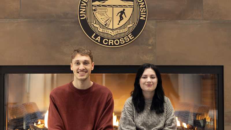 Jordyn York (right) and Riley Radle finished first and second, respectively, in a logo design contest for the College of Business Administration. The contest was part of an advanced digital art and graphic design course taught by Marc Manke.