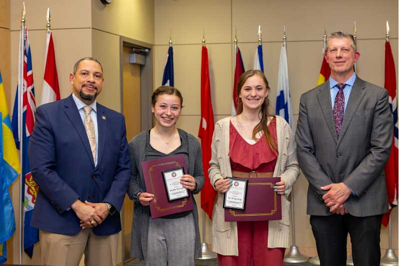 UWL seniors Maddie Krueger and Ila Tregoning both received the Eagle Achievement Award for volunteering 400 or more hours. They are pictured with La Crosse Mayor Mitch Reynolds and Vice Chancellor of Student Affairs Vitaliano Figueroa. From left Figueroa, Krueger, Tregoning and Reynolds.