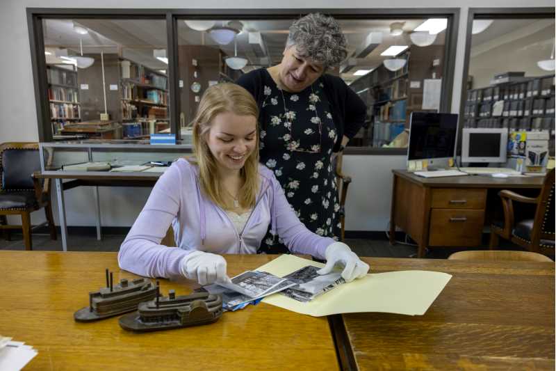 Penelope Hardy, associate professor of history, conducts research on oceanic history globally. This summer she works with Visiting Scholar Gillian to create a collection of primary sources on freshwater waterways. Pictures, in addition to books, have helped the two researchers think of all of the different ways people have relationships with water from ice fishing to baptisms.