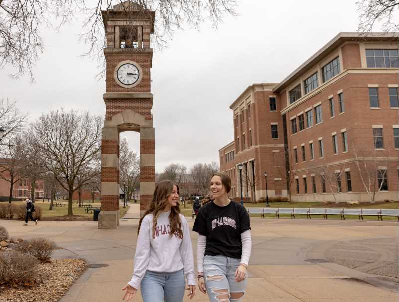UWL student Lilly Ninneman, left, walks with a friend through campus. She advises students to 