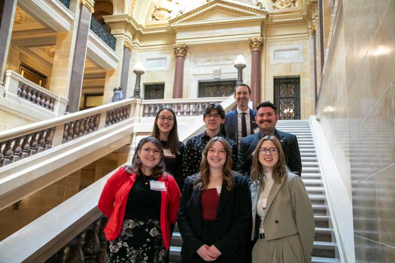 Professor Nicholas Bakken, UWL Student Research and Experiential Learning Coordinator, back, led a delegation of UWL student researchers to the Research in the Rotunda event at the capitol in March. Bakken is also coordinating a contingent of more than 40 students attending the National Conference on Undergraduate Research in Eau Claire April 13-15. 