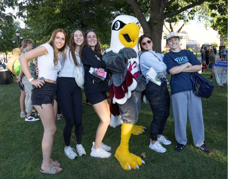 Students pose with Stryker Eagle on the UW-La Crosse campus.