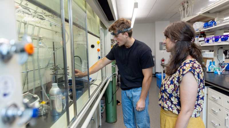 Roman Domashevsky, a junior majoring in biology with a biomedical concentration, was part of the Dean’s Distinguished Fellowship program this summer. Here, he works inside the Prairie Springs Science Center’s chemistry lab alongside his faculty mentor, Robin Grote.