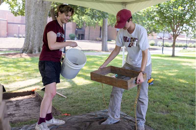 Archaeology students working with UWL archaeologist Heather Walder uncovered a layer of early- to mid-20th-century debris about five inches below the surface at the site of a planned medicine garden. The archaeological survey helped researchers understand the site's history before garden construction begins and provided community outreach opportunities. 