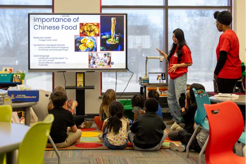 UWL students in the Chinese Studies program engage kids in an after-school Chinese Clubs at a local elementary school. 