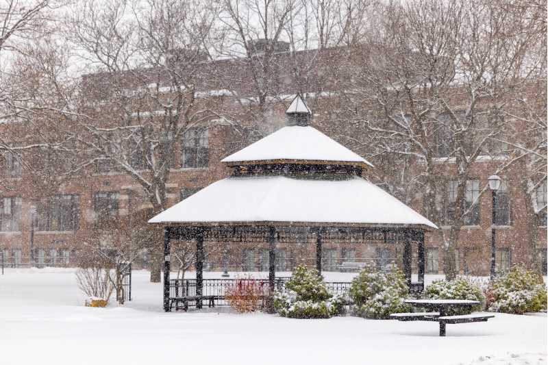Snowfall blankets the gazebo between Wing Technology Center and Morris Hall.