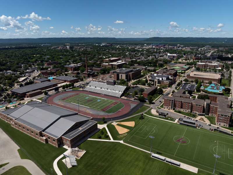 An Eagle's-eye view of campus with the Mississippi River and Minnesota bluffs beyond.